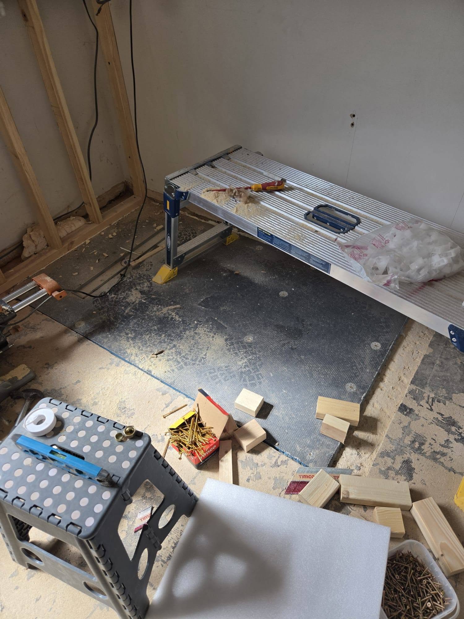 Framed out: New stud work and floor preparation.