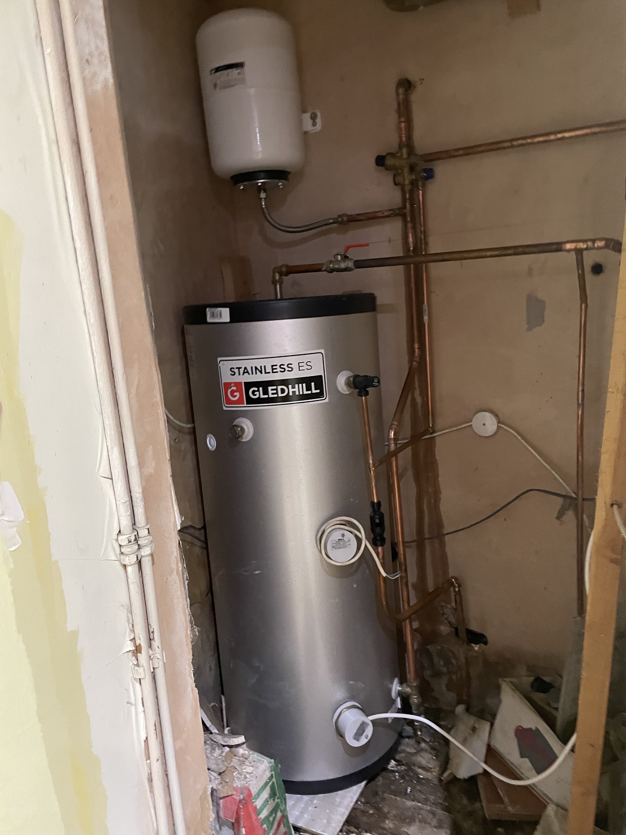 A newly fitted Gledhill stainless unvented hot water cylinder with copper pipework